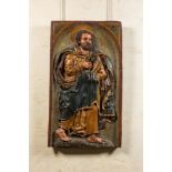 A large Spanish polychrome wooden alto relievo depicting Saint Peter, 17th C.