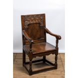 An inlaid carved oak chair with a Star of David, 17th C.