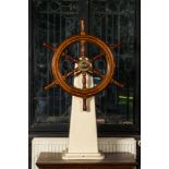 A wooden steering wheel of a boat, 20th C.