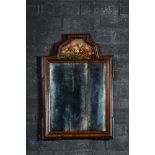 A Dutch mahogany mirror with ebonised frames and a reverse glass painting, 19th C.