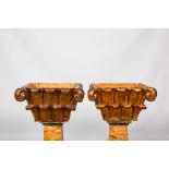 A pair of gilt and lacquered wooden Corinthian capitals, 19th C.