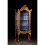 A richly carved gilt wooden Rococo-style display cabinet, 19th C.