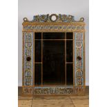 An imposing richly decorated polychrome wooden mirror, 20th C.