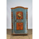 A German polychrome painted single door linen cupboard, dated 1853