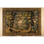 A Flemish wall tapestry with a forest view with a castle, 17th C.