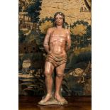 A polychromed stone figure of Saint Sebastian, 17th C.