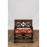 A Gothic Revival oak wooden church chair, 19th C.