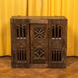 An English gothic style carved oak hanging cupboard composed of old elements, 17th C. and later