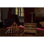 A patinated wooden miniature commode and a maquette for a roof, 19th C.