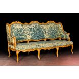 A large French Louis XV beechwooden sofa with embroidered upholstery, 18th C.