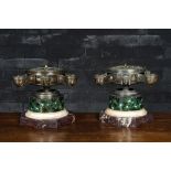 A pair of French silver-plated bronze neoclassical oil lamps on a marble and faux marbre base, 19th