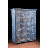 A French blue patinated oak two-door cupboard, 20th C. with older elements