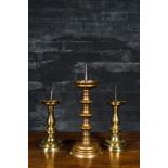 A bronze knob candlestick and a pair of baluster candlesticks, Flanders, 15/16th C. and later