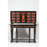 An ebonised wooden cabinet with faux-tortoiseshell veneer, 19th C.