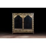 A Gothic Revival mirror bookcase with black- and gold-painted rural scenes and foliage, 19th C.