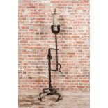 A large wrought iron candlestick transformed into a lamp, 19th C.