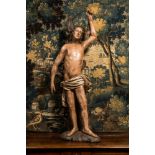 A large German polychrome wooden sculpture of Saint Sebastian, 16h C.