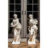 Two large white painted concrete garden statues with allegorical depictions of seasons, 20th C.