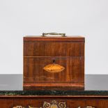 An English mahogany liqueur cellar with six partly gilt carafes, 19th C.