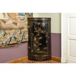 A painted wooden corner cupboard with chinoiserie design, probably England, 18th C.