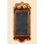 A large partly gilded mahogany veneered wooden Louis XV-style mirror, 19/20th C.