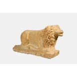 A marble model of a reclining lion, 20th C.
