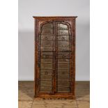 An Indian metal mounted hardwooden cupboard, 20th C.