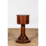 An octagonal mahogany one-door cabinet table, 19th C.