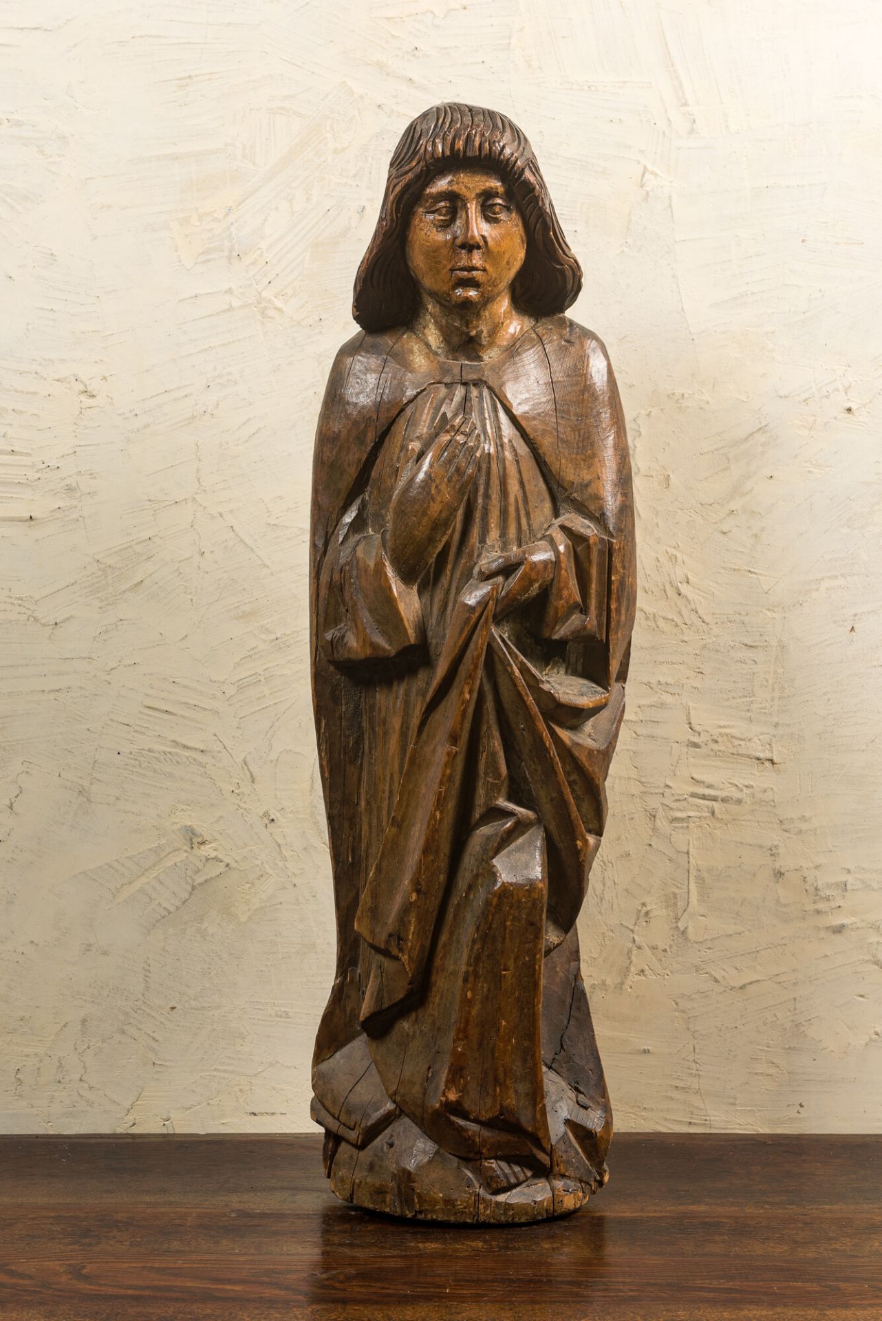 A large walnut figure of John the Baptist from a calvary, late 15th C.