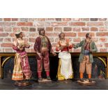 Two pairs of Italian polychrome wooden and terracotta figures in traditional costume, Napoli, 19th C