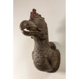 A polychrome wooden sculpture of a dodo's head, 20th C.