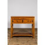 A Chinese wooden console with two drawers, 20th C.