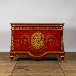 A red lacquered and gilt chest of drawers, 20th C.