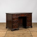 A small wooden nine drawer-desk, 19th C.