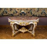 An attractive partly gilt wooden table with marble top, Italy, 18/19th C.