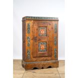 A German polychrome pine single-door cupboard, 18/19th C.