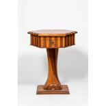 A hexagonal oak wooden and walnut work table on a central base, 19th C.