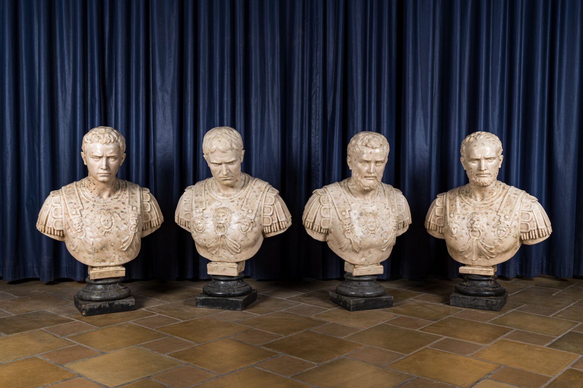 Four Italian faux marble busts of Roman emperors, 19/20th C.