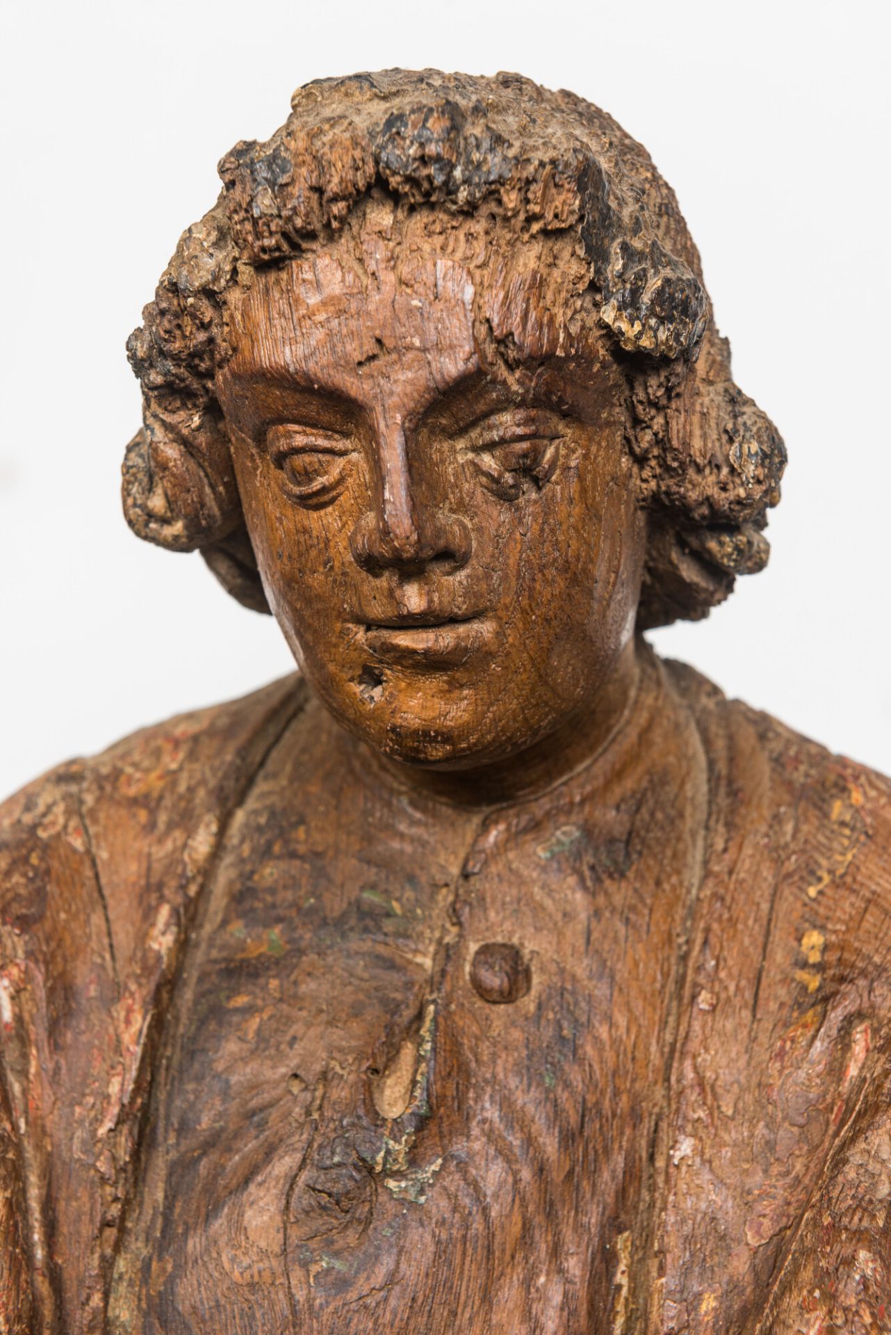 A Flemish oak figure of Saint John with traces of polychromy, 16th C. - Image 3 of 3