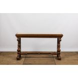 A richly carved wooden wall console with marble top, 19th C.