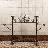 A Gothic Revival wrought iron andiron or firescreen, 19th C.