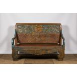A large Indian polychrome wooden couch with floral design, 20th C.