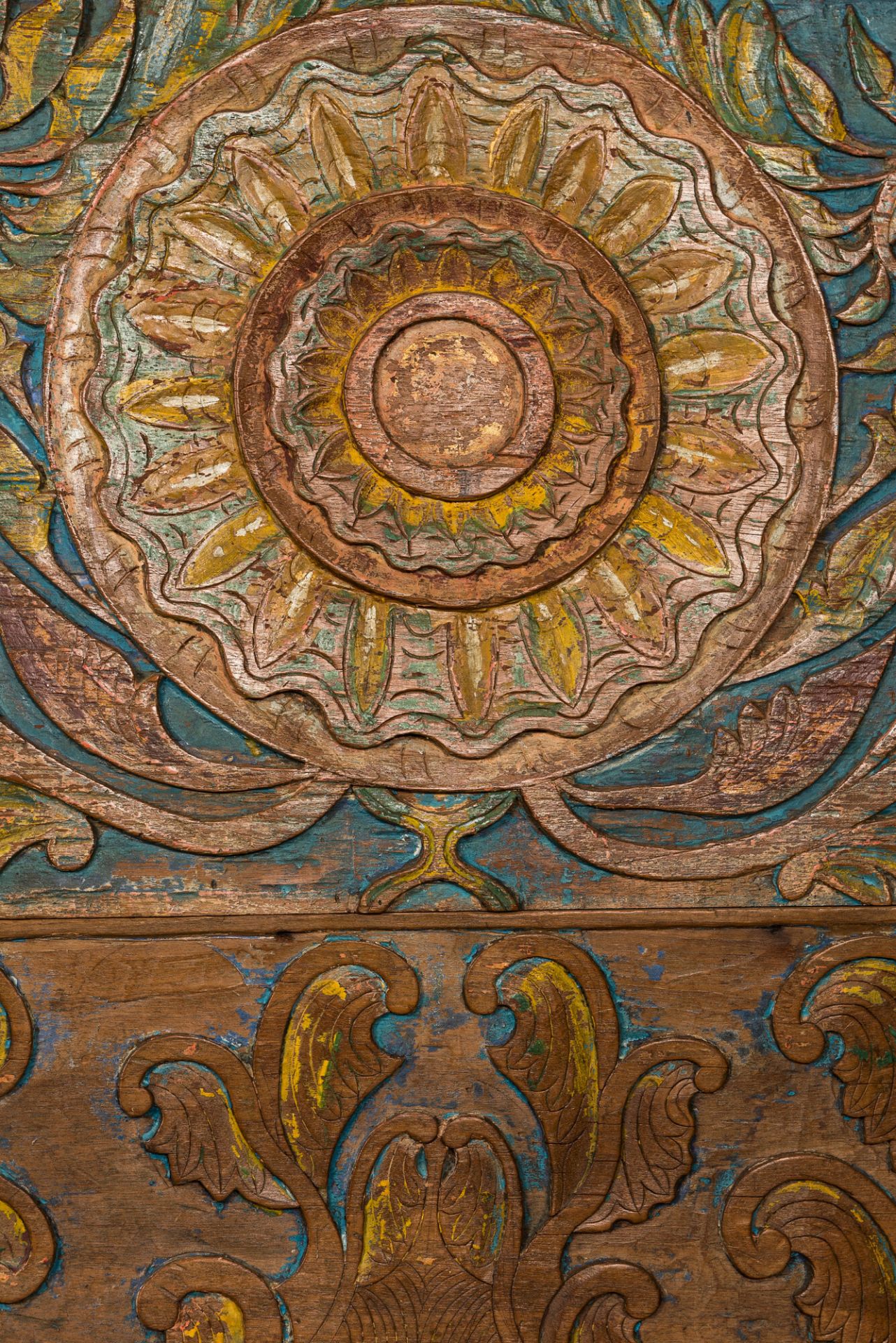A large Indian polychrome wooden couch with floral design, 20th C. - Image 3 of 4