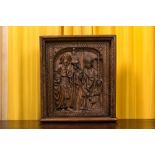 A carved oak panel depicting Saint James with a bishop, The Low Countries, late 15th C.