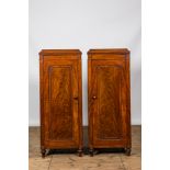 A pair of mahogany linen cupboards, ca. 1900