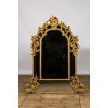 A French finely carved gilded wooden Louis XV-style rocaille mirror, 19th C.