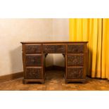 A wooden desk with six drawers with painted panels, 19th C.