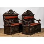 A pair of richly carved wooden hall benches, 19th C.