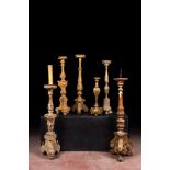 Six large partly gilt and painted wooden candlesticks, 18/19/20th C.