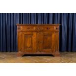 An Italian walnut sideboard with two doors and three drawers, 18th C.